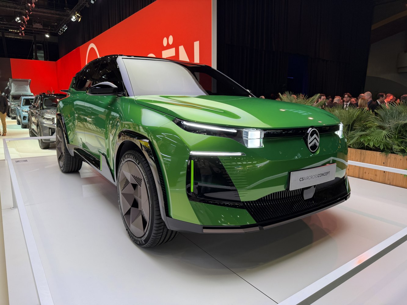 Concept SUV with futuristic LED headlights and green geometric front design