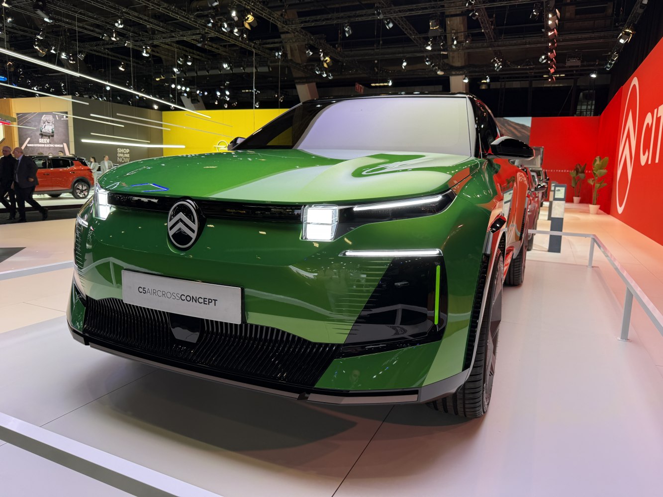 Futuristic front design with distinctive LED lights on green SUV concept