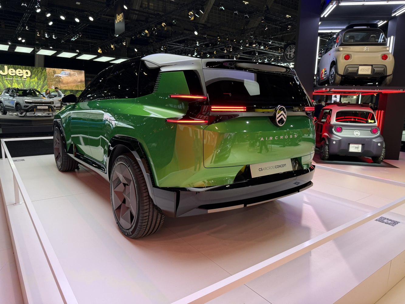 Rear view and taillight design of a futuristic green SUV concept