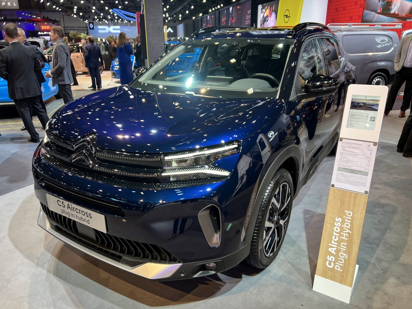 Front view of a plug-in hybrid SUV with LED headlights and modern grille