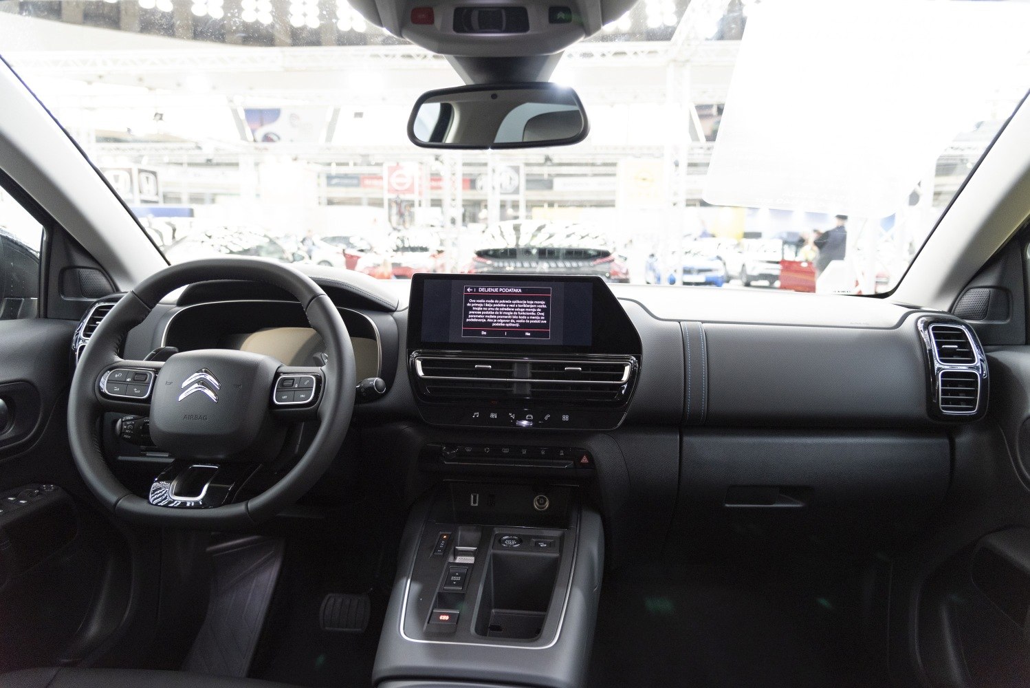 Modern car interior with dashboard and multifunction steering wheel