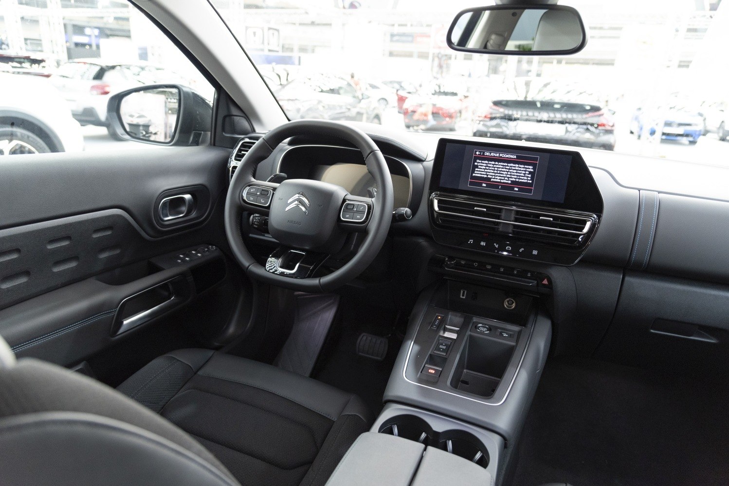 Modern steering wheel and digital dashboard with touchscreen display