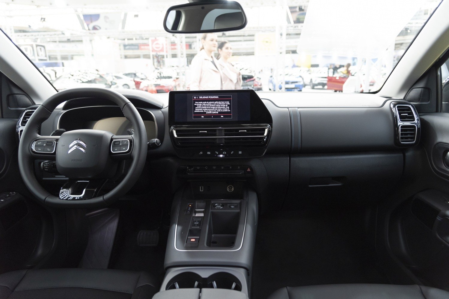 Modern dashboard with touchscreen display and multifunction steering wheel