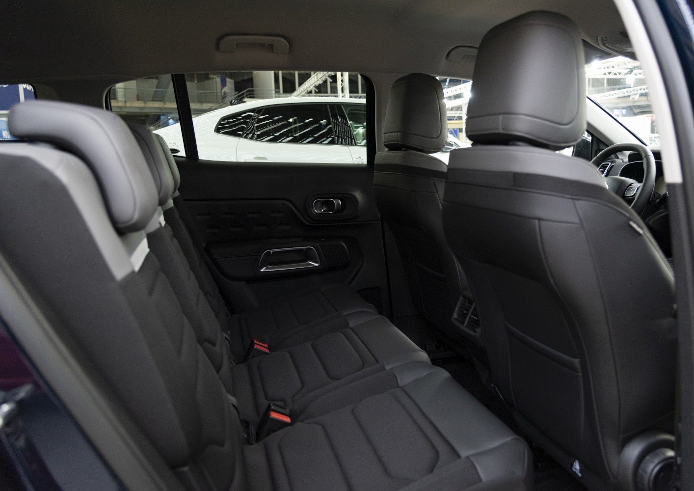 Spacious, modern rear seating with integrated headrests and door panel details