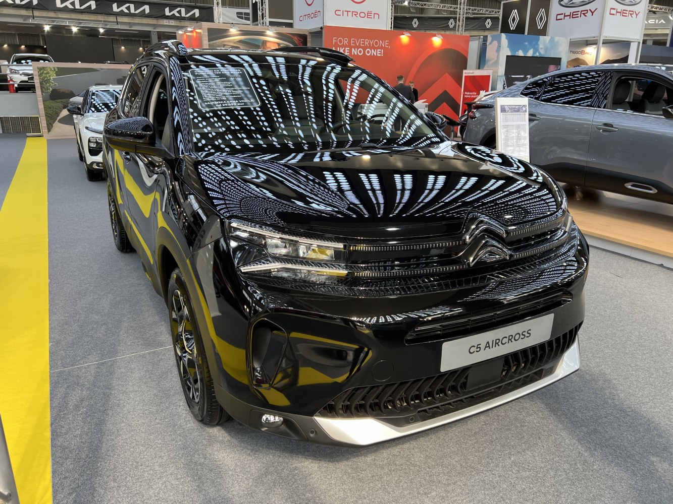 Front view of black SUV with LED headlights and modern grille