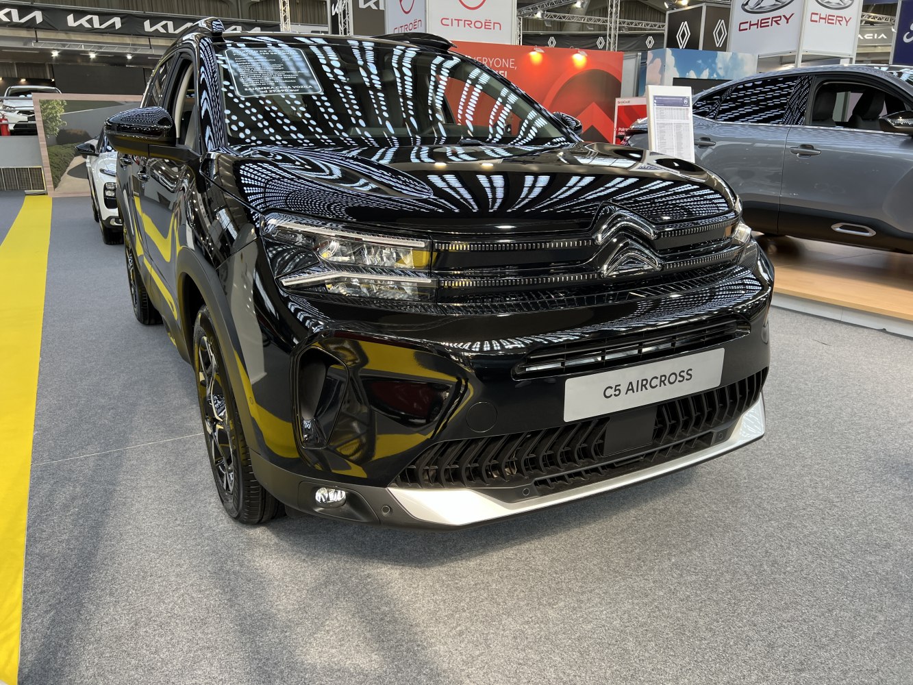 Modern SUV front with LED headlights and prominent grille design