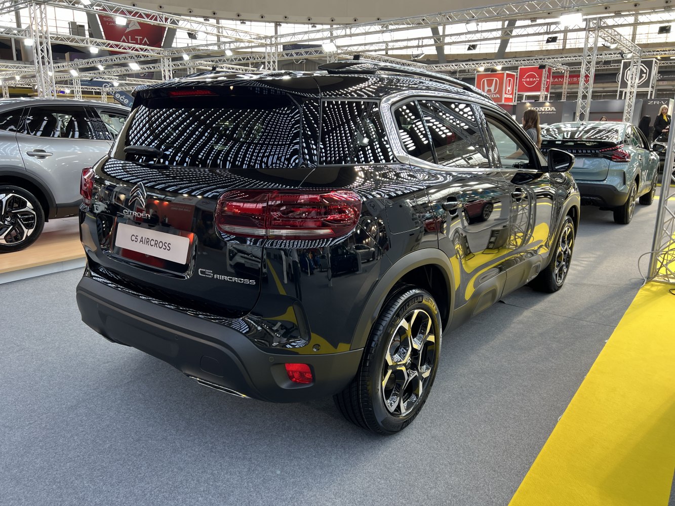 Rear view of modern SUV with distinctive taillights and alloy wheels