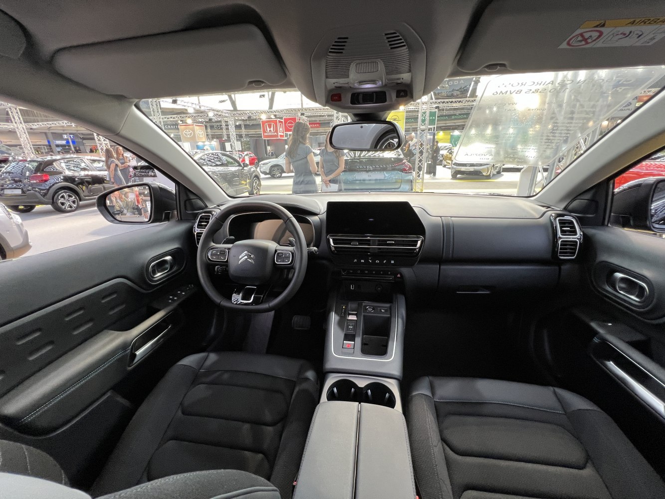 Modern car interior with dashboard and multifunction steering wheel