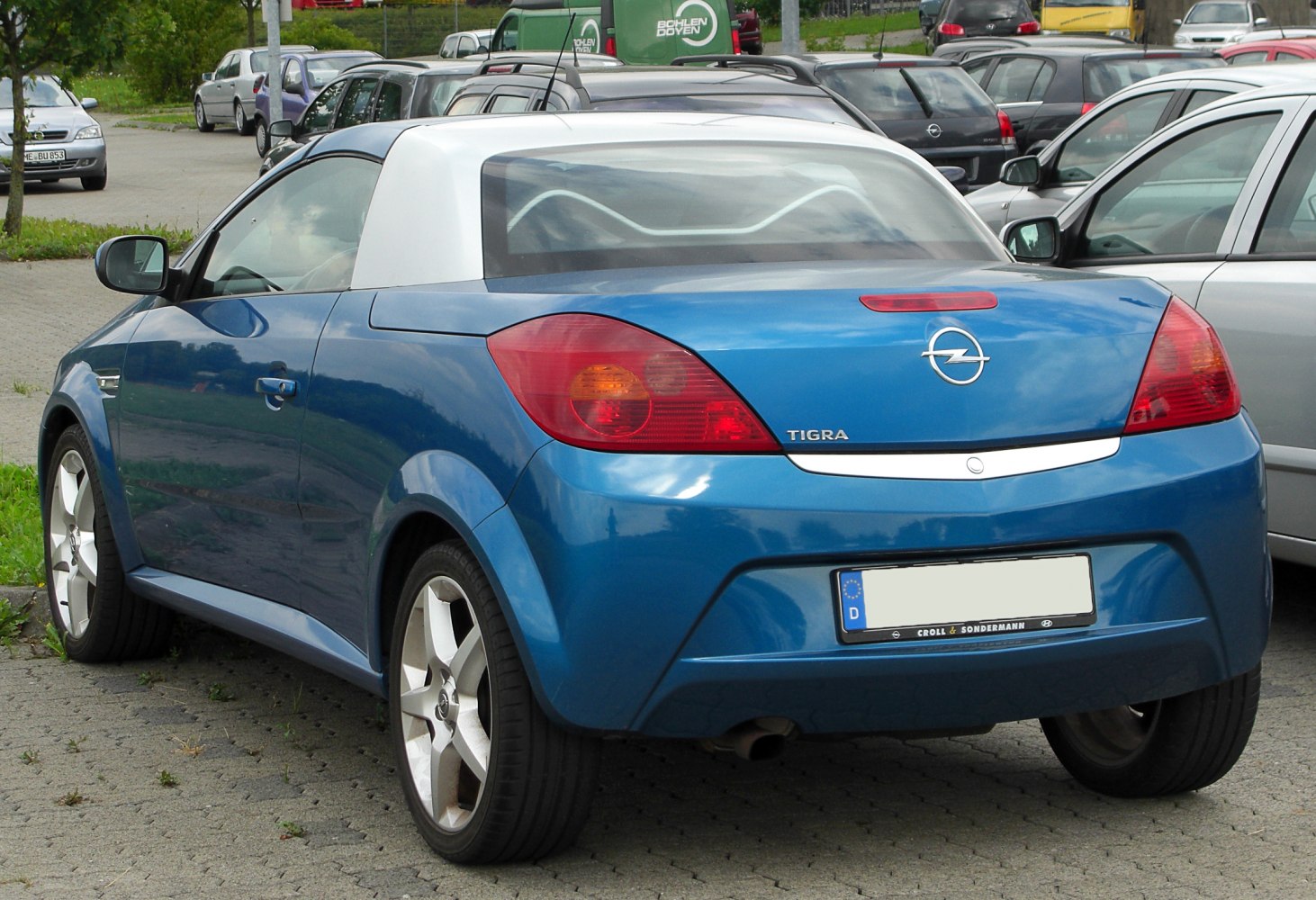 Blue compact coupe with silver hardtop and rear lights