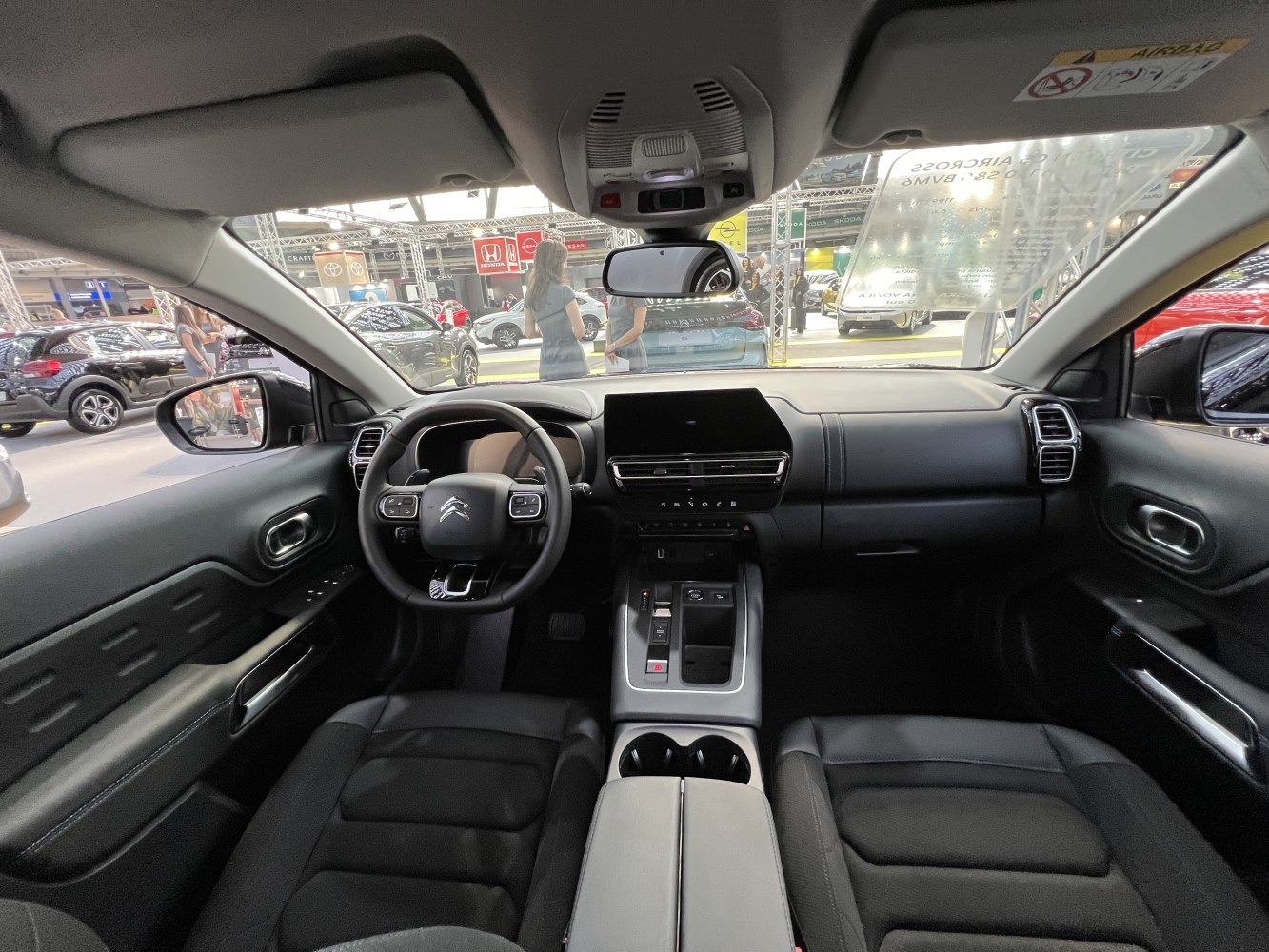 Black leather seats and modern touchscreen dashboard interior