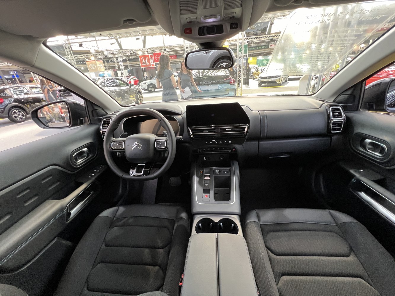 Interior dashboard and steering wheel with digital displays and modern controls