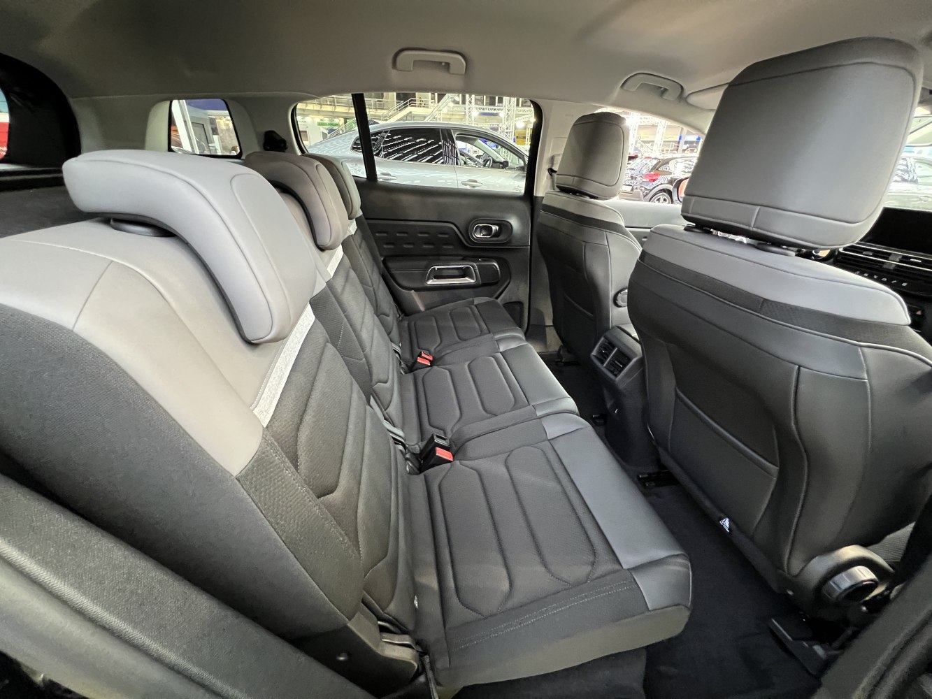 Spacious rear seats with black upholstery and adjustable headrests