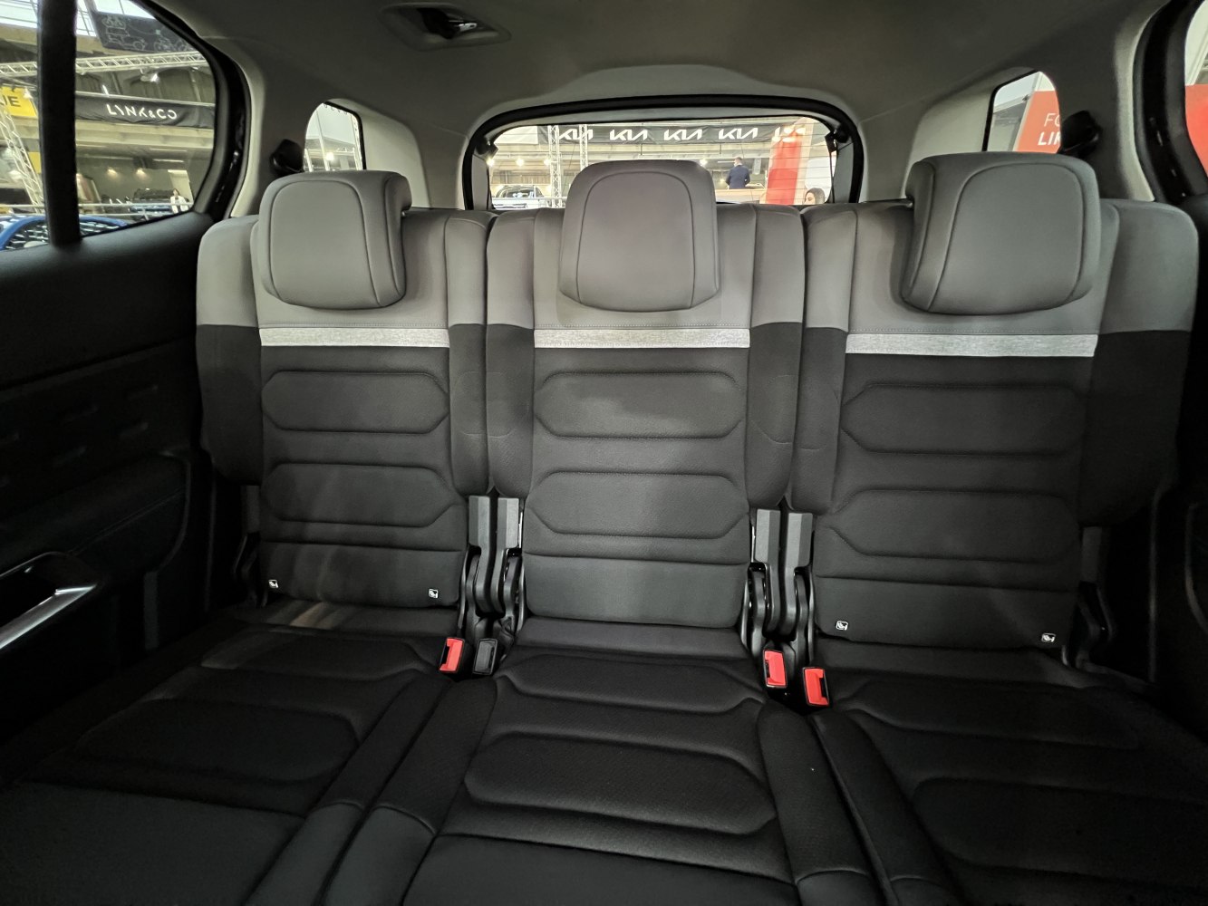 Rear seat interior with black and gray upholstery and headrests