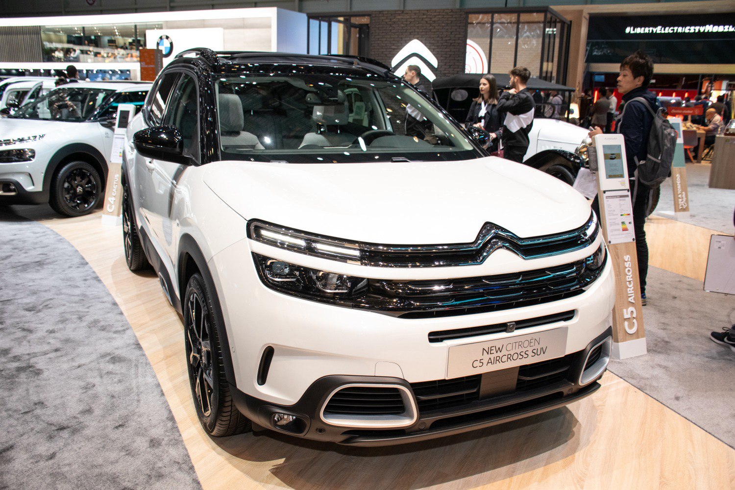 Front view of SUV with split LED headlights and bold grille design