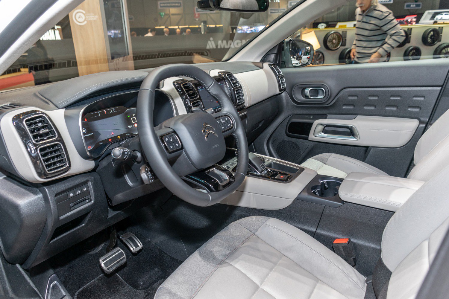 Modern car interior with digital dashboard and multifunction steering wheel