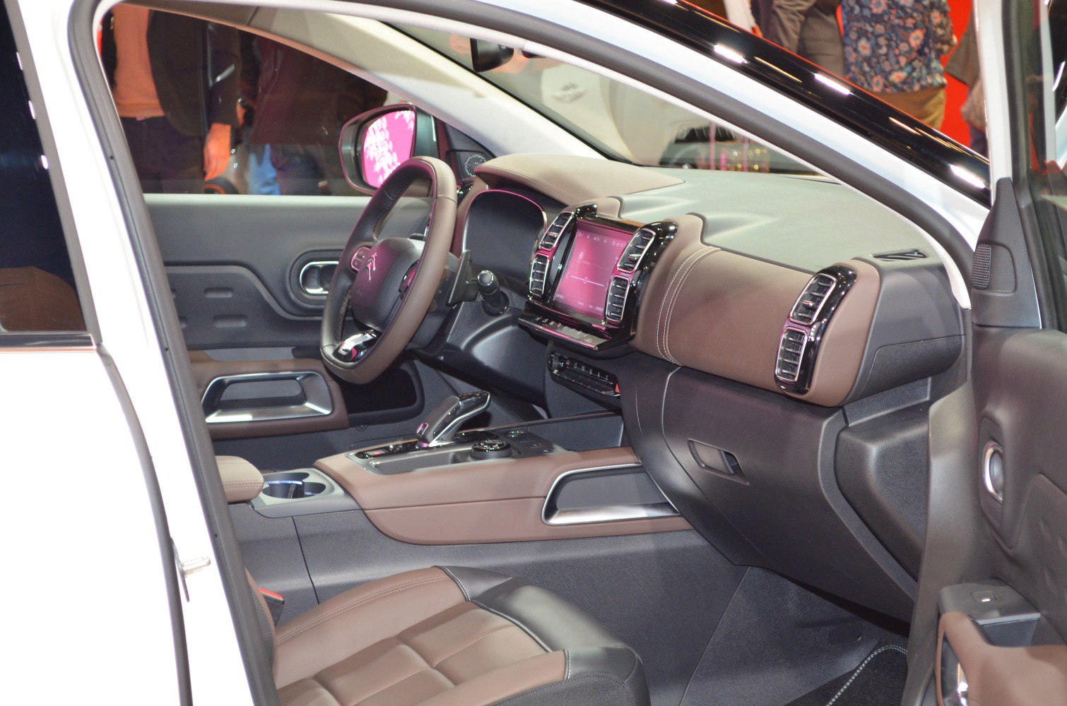 Modern dashboard and steering wheel interior with touchscreen and air vents