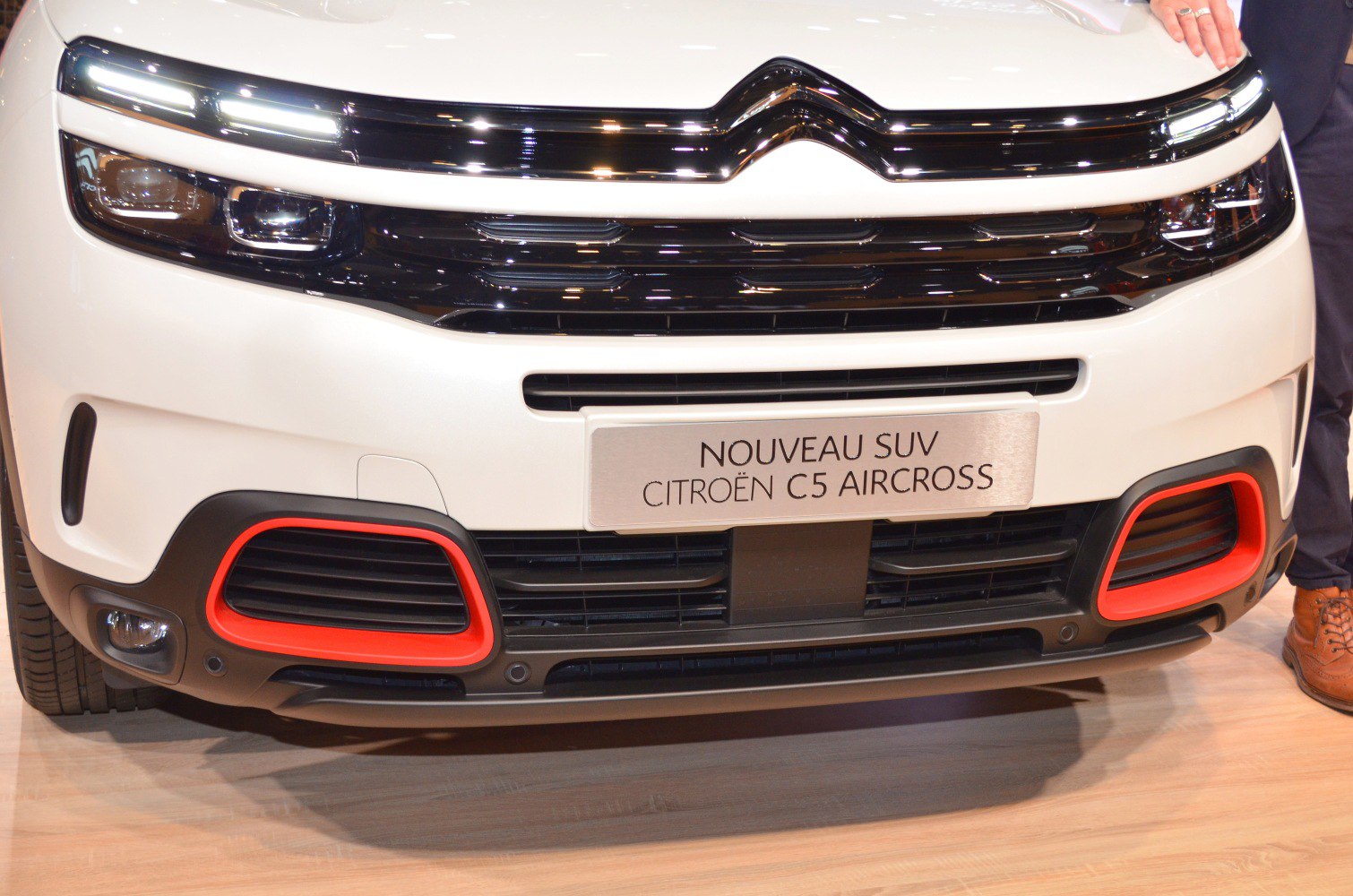 Front grille with LED headlights and red trim details