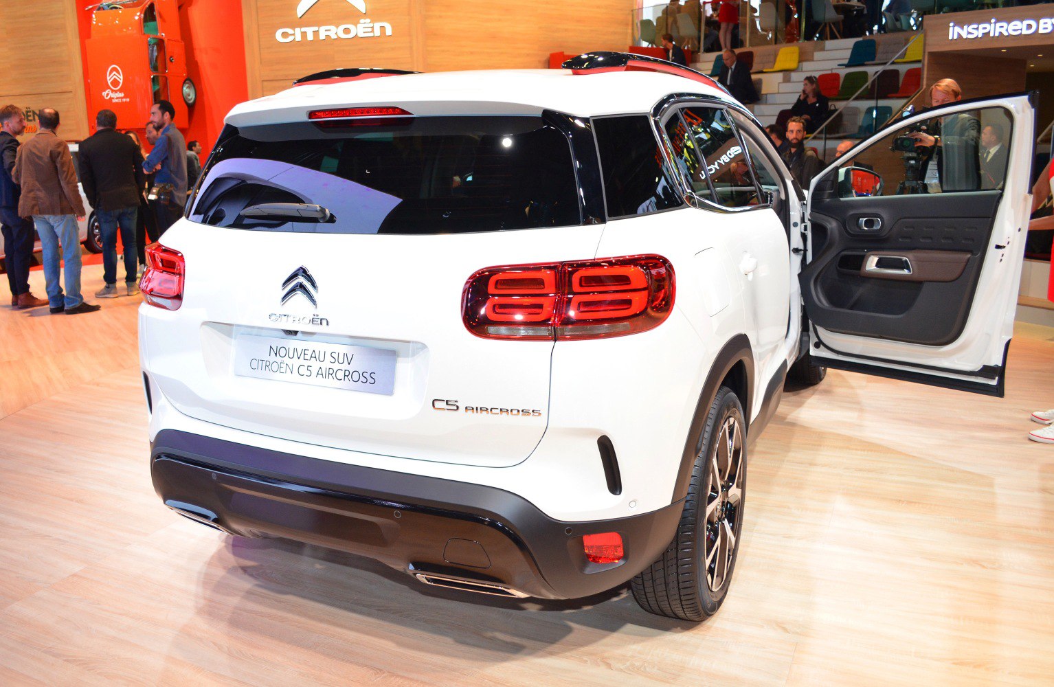 Rear view of SUV with custom taillights and open rear door