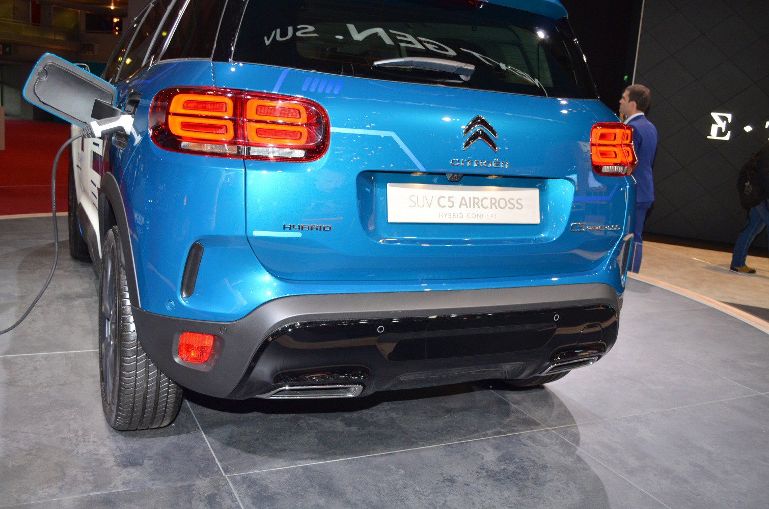 Rear view of hybrid SUV with charging port and distinctive taillights