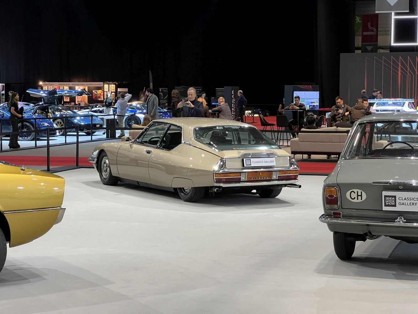 Rear and side view of a classic angular car in beige color