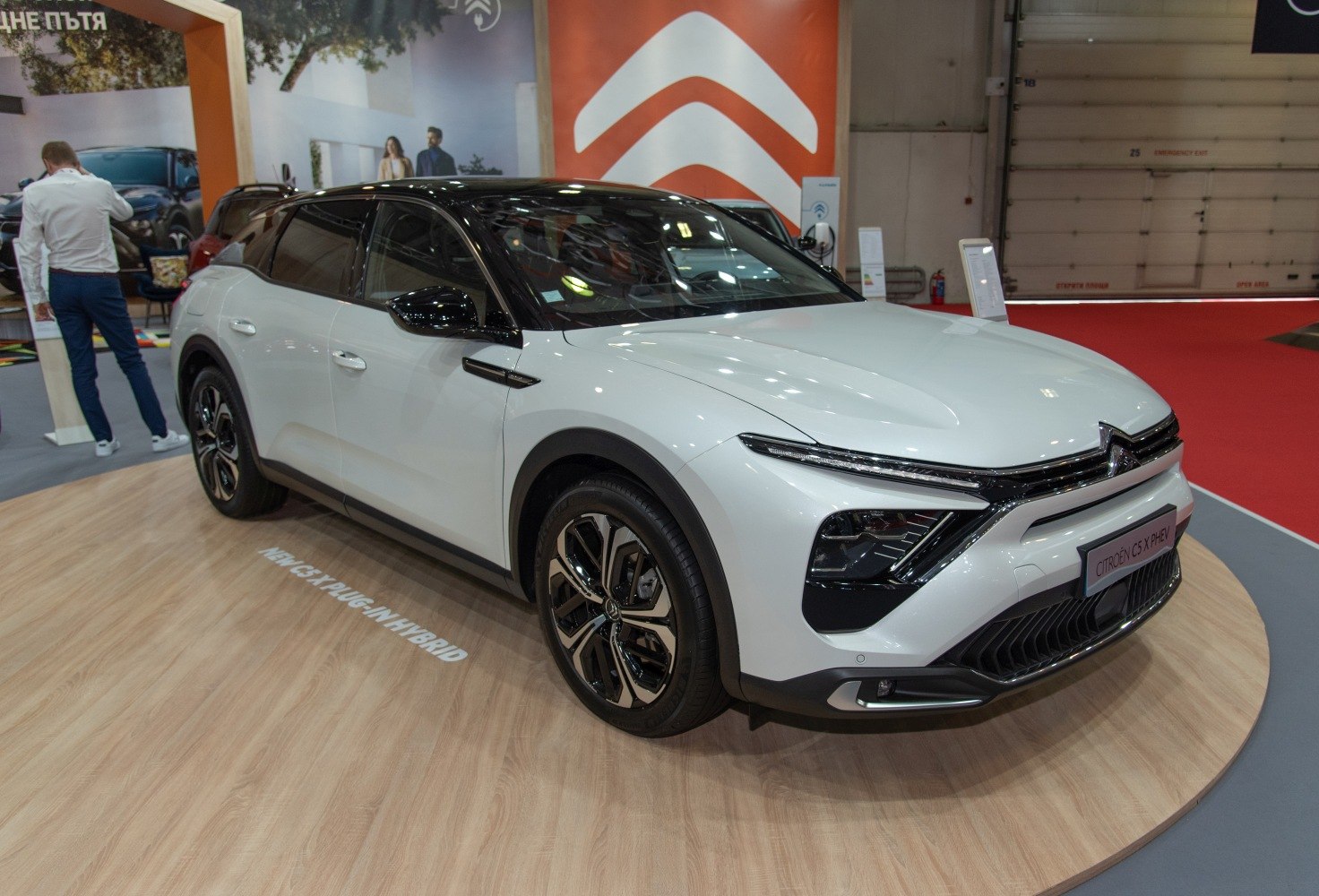 Front-side view of white and black electric SUV with sleek modern design