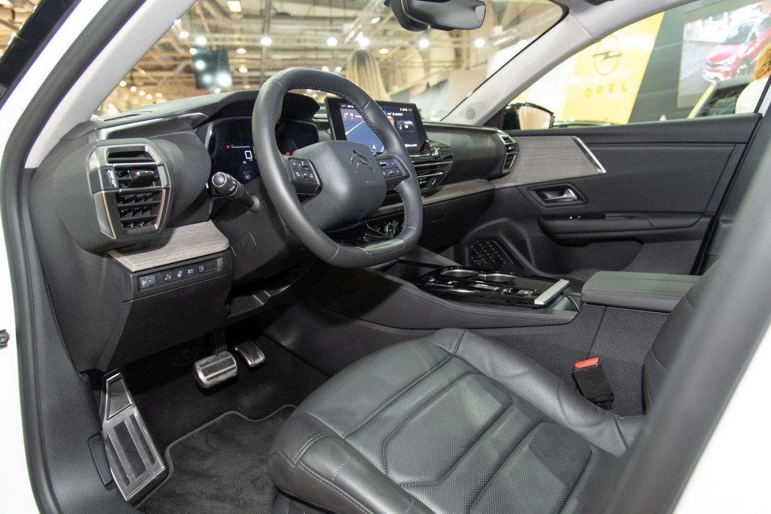Modern car interior with digital dashboard and leather seats