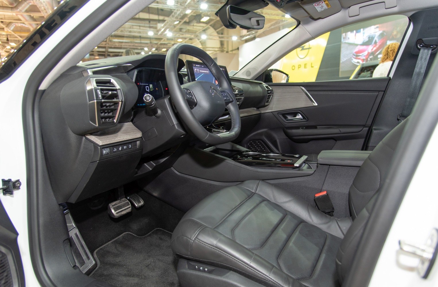 Modern car cockpit and dashboard with leather driver seat