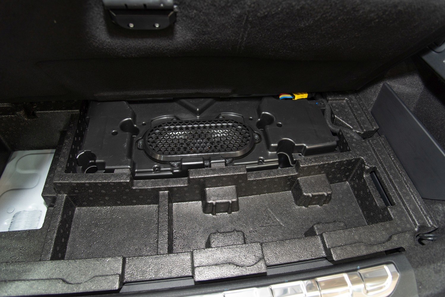 Underfloor storage compartment and battery area with foam tray