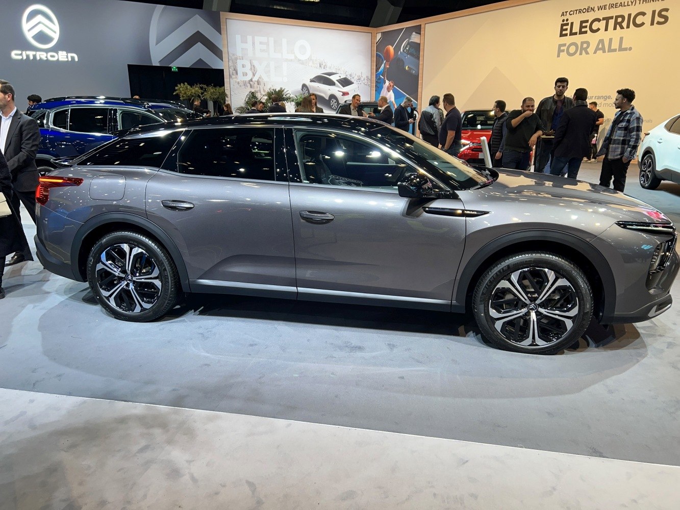 Sleek crossover SUV side profile with alloy wheels and metallic finish