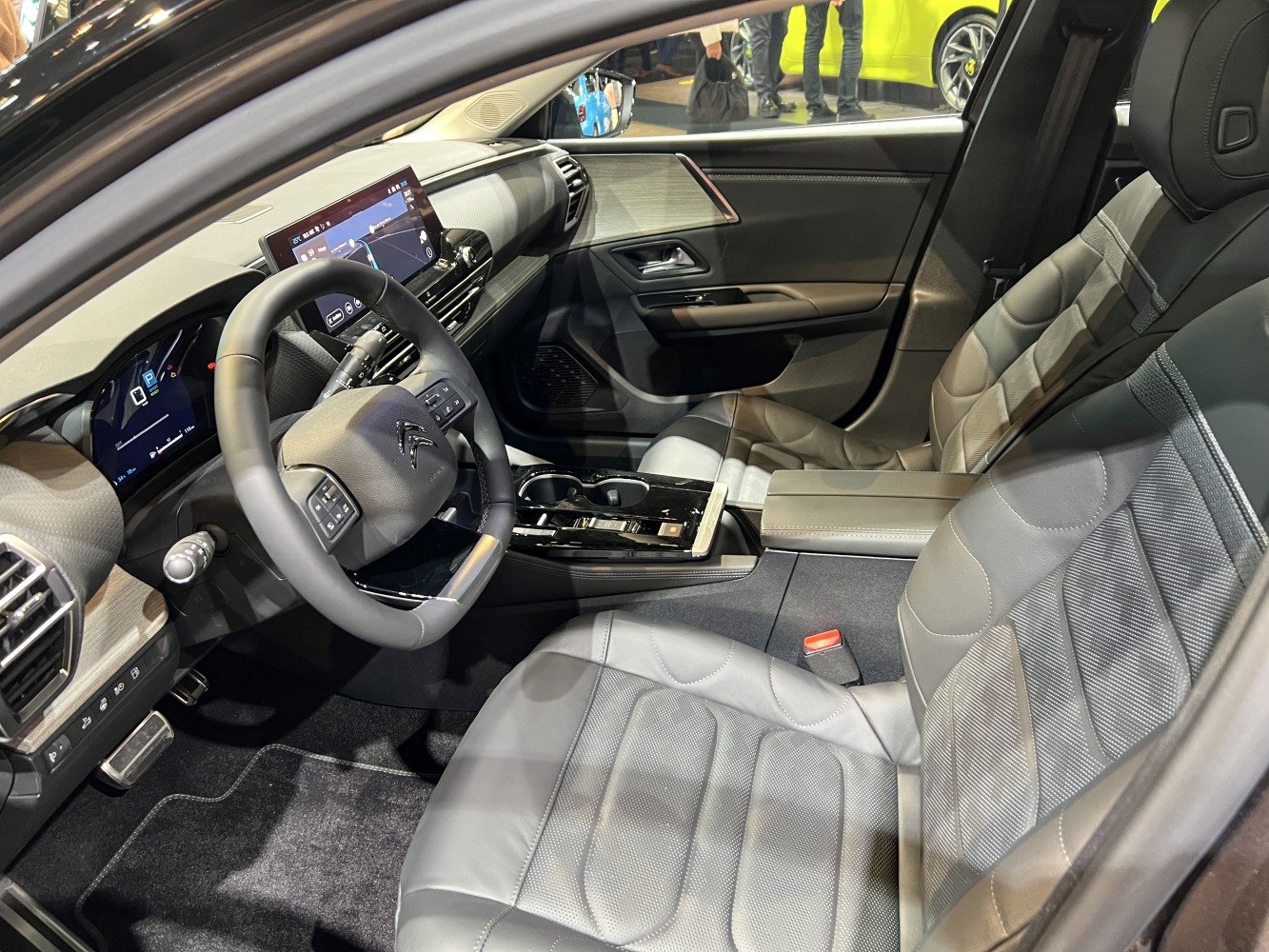 Modern dashboard with digital displays and leather front seats