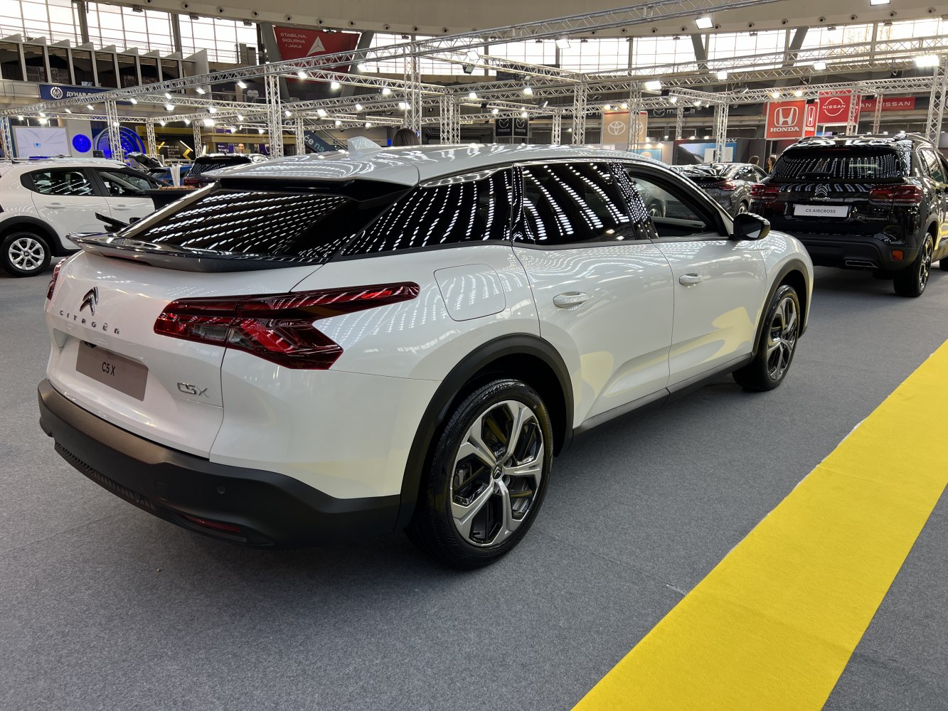 Rear and side view with LED tail lights and rear spoiler