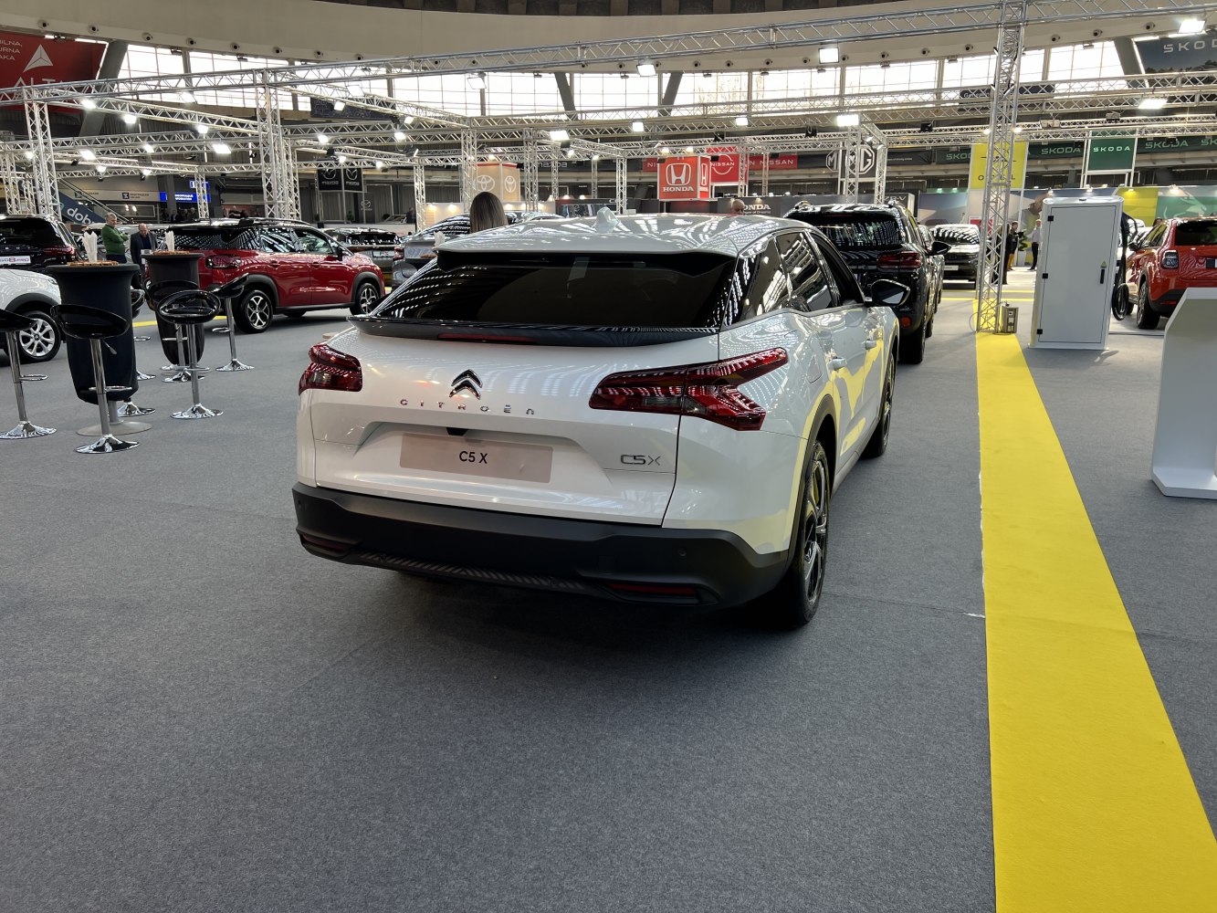 Rear perspective of white crossover with LED tail lights