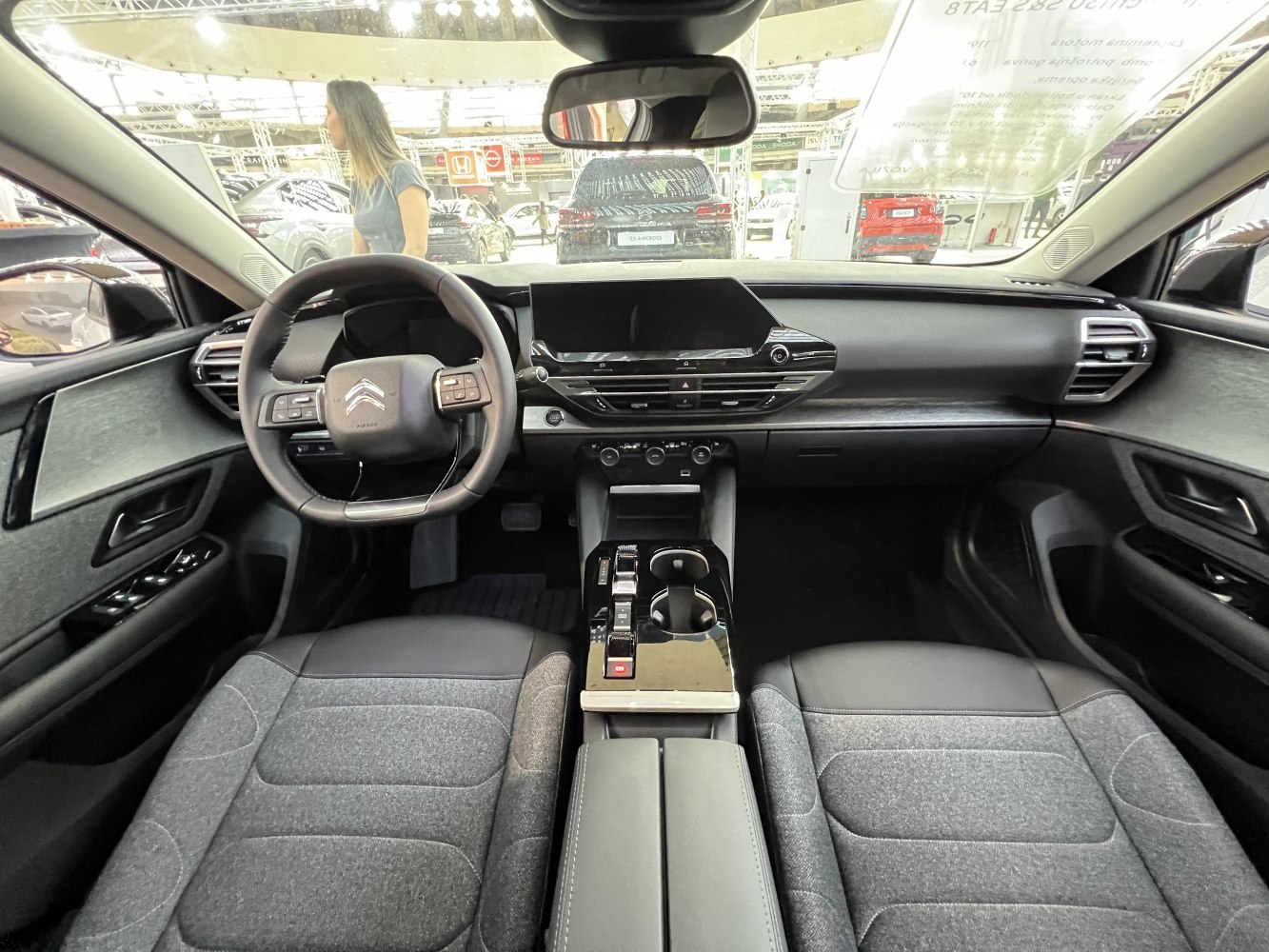 Modern car interior with digital dashboard and multi-function steering wheel