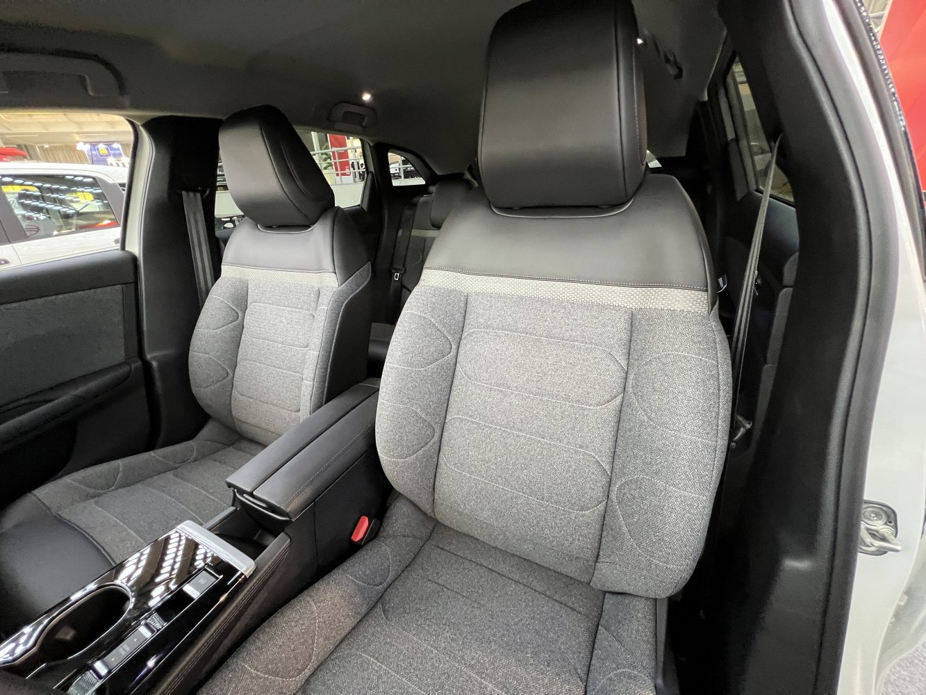 Front fabric seats and center console with cup holder