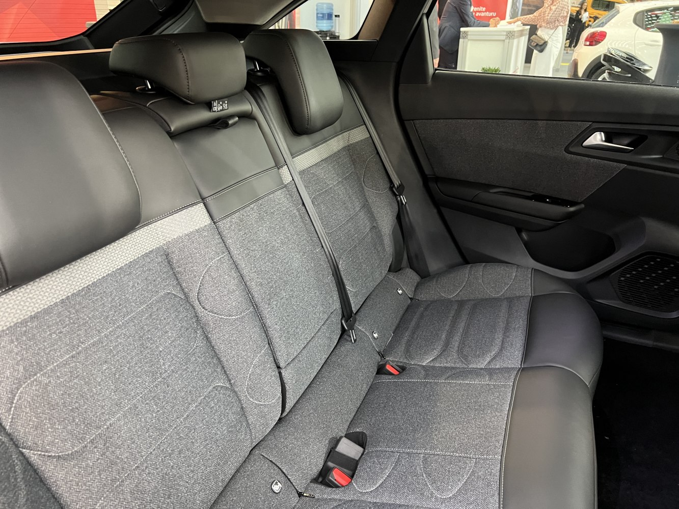 Two-tone rear seat interior with leather and fabric upholstery