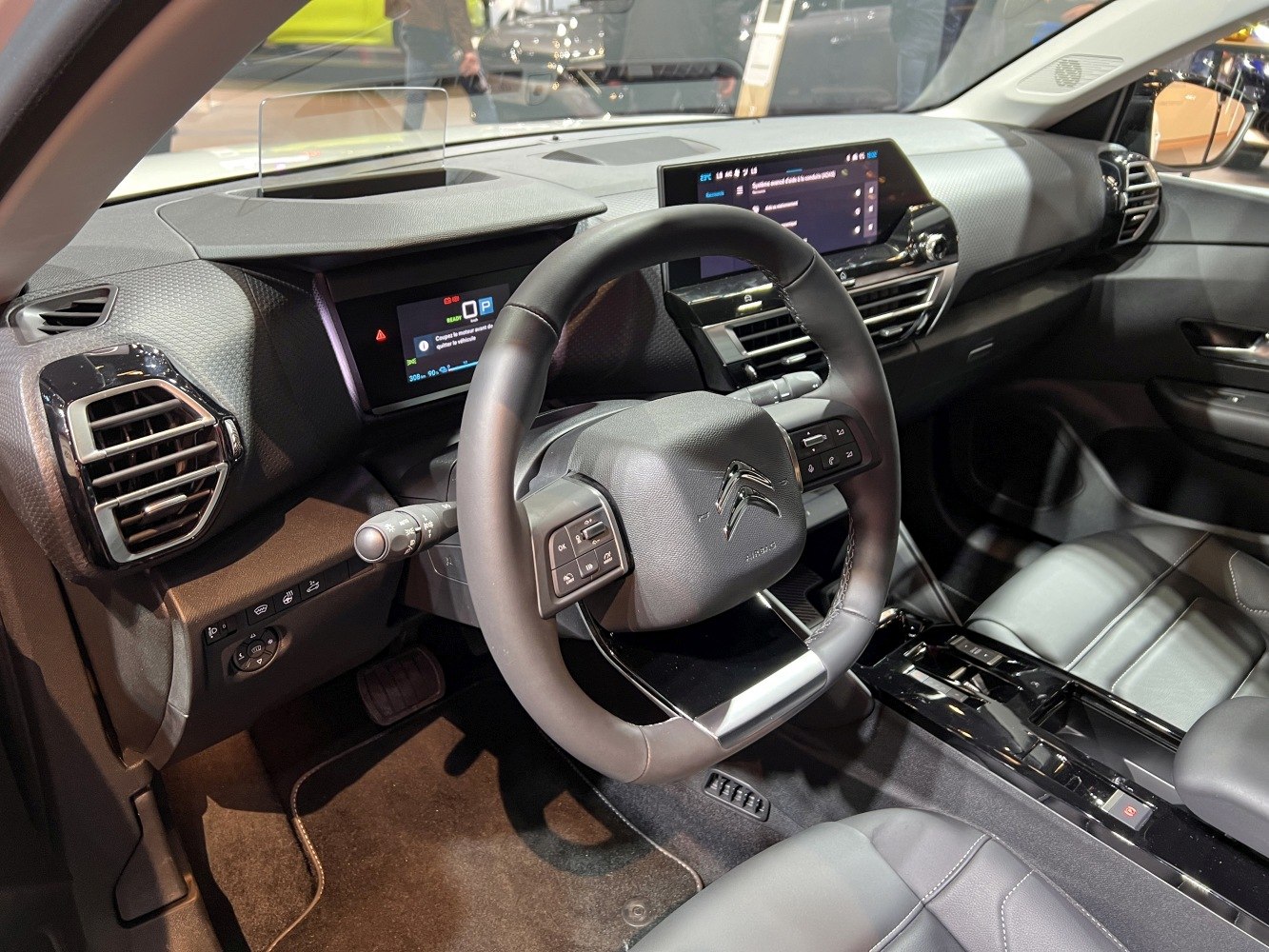 Digital dashboard and multifunction steering wheel in car interior