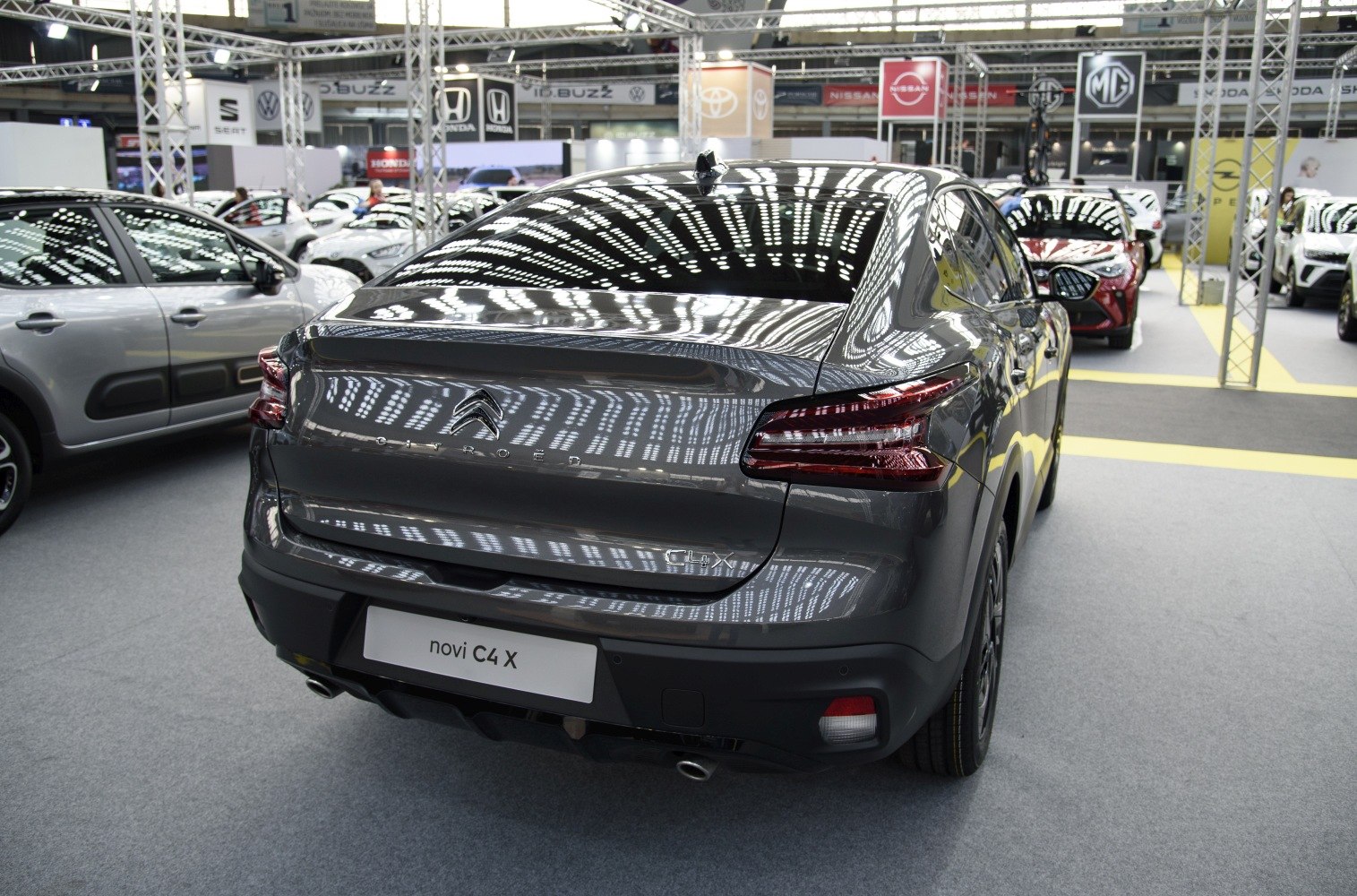 Rear view of a modern hatchback with distinctive taillights and smooth aerodynamic design.