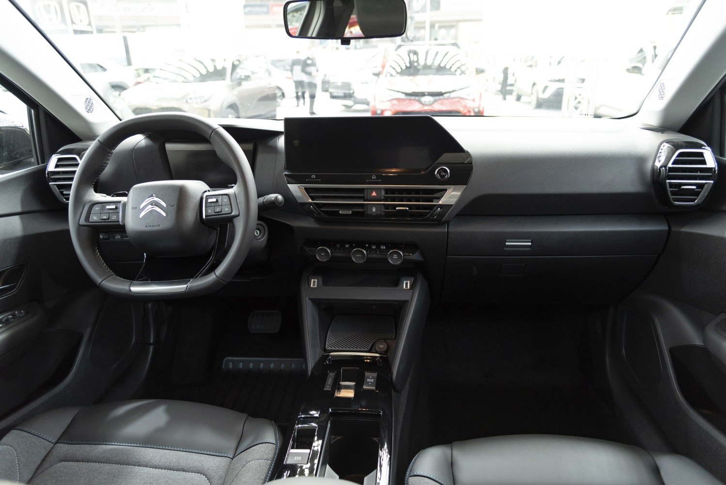 Modern dashboard with touchscreen and multifunction steering wheel