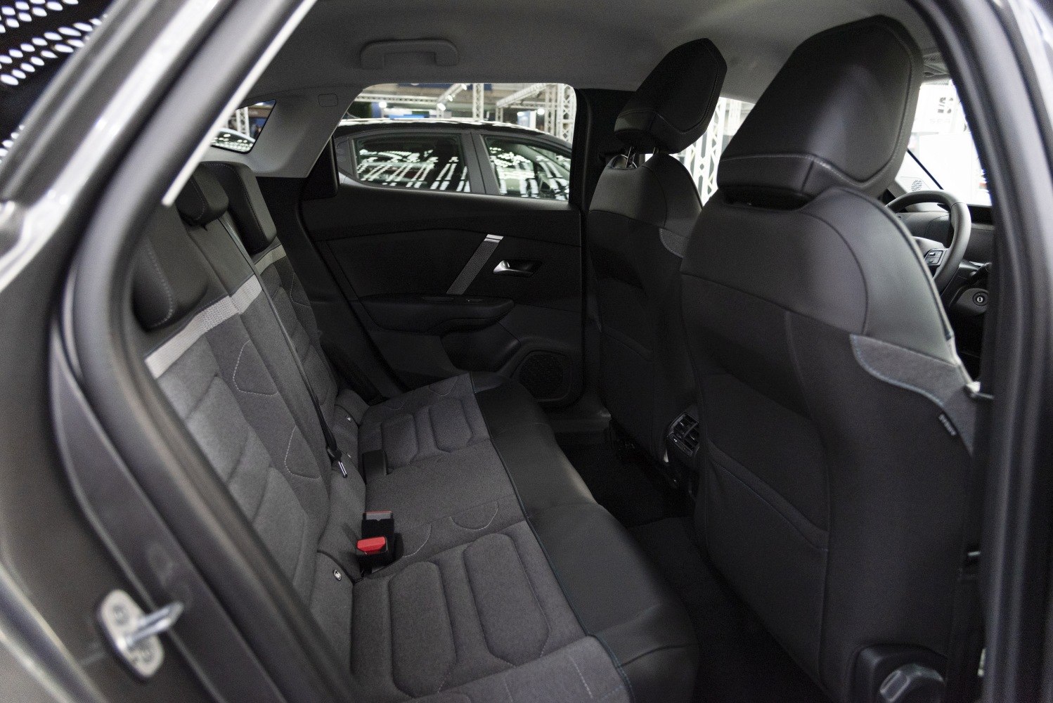 Spacious rear seating and modern car interior design with fabric and leather upholstery