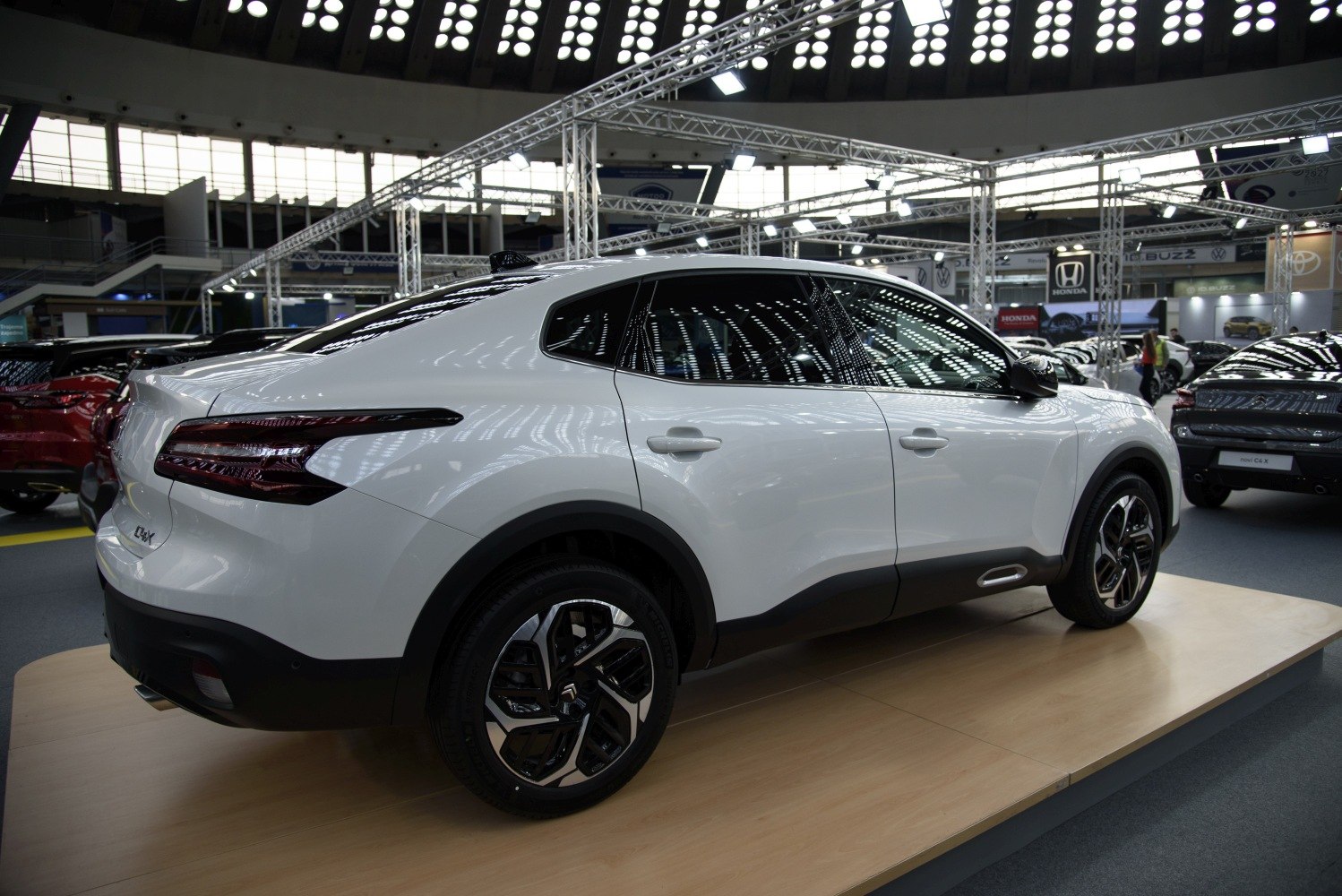 Side view of white crossover with unique rear lights and black accents