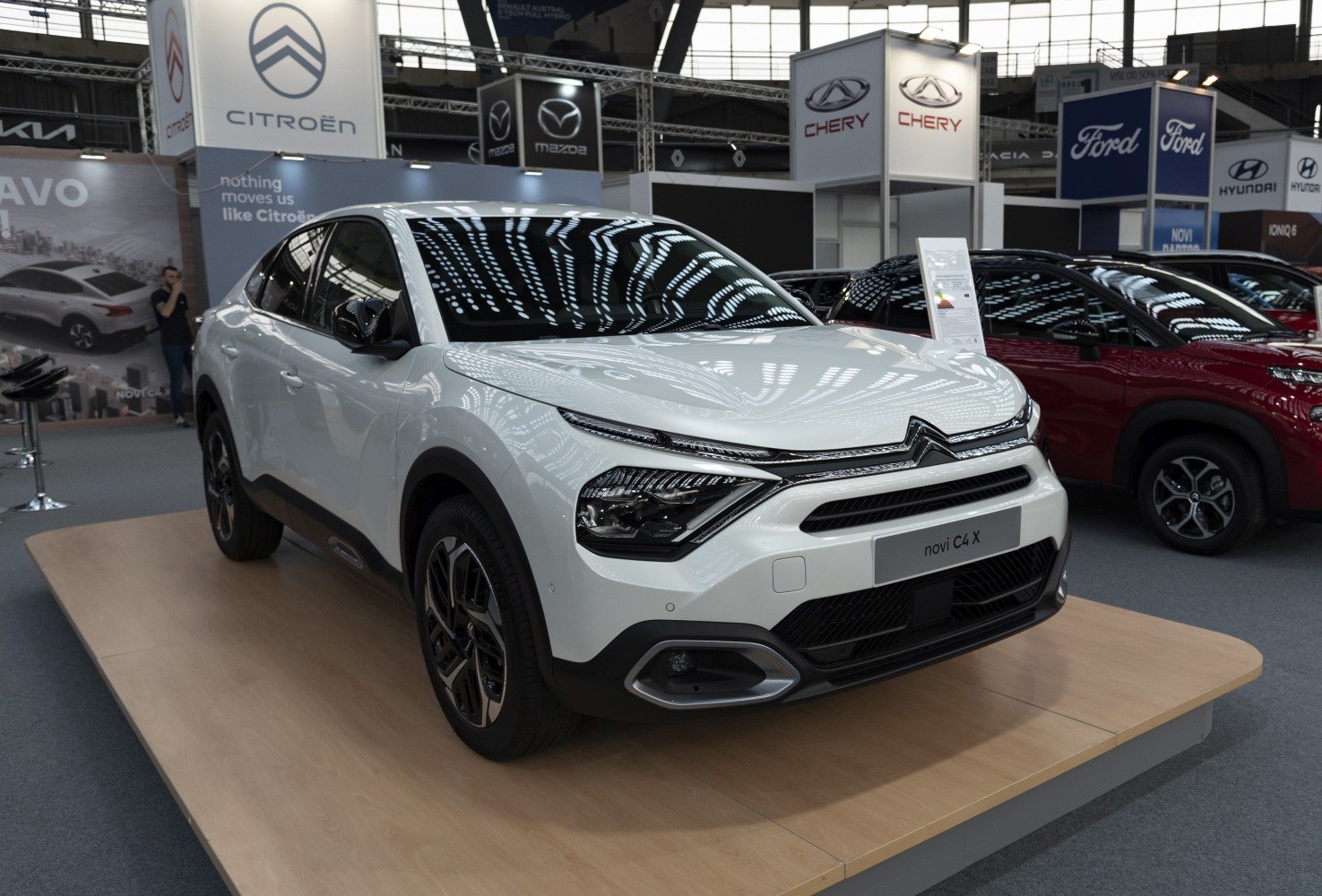 Front view of modern vehicle with LED headlights and bold grille