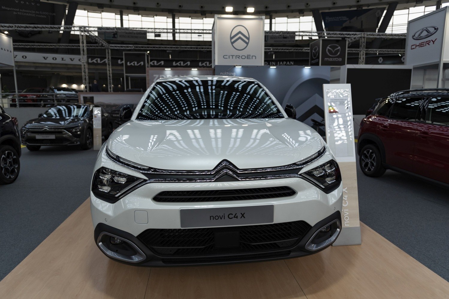Modern front grille and sleek headlight design with embossed logo