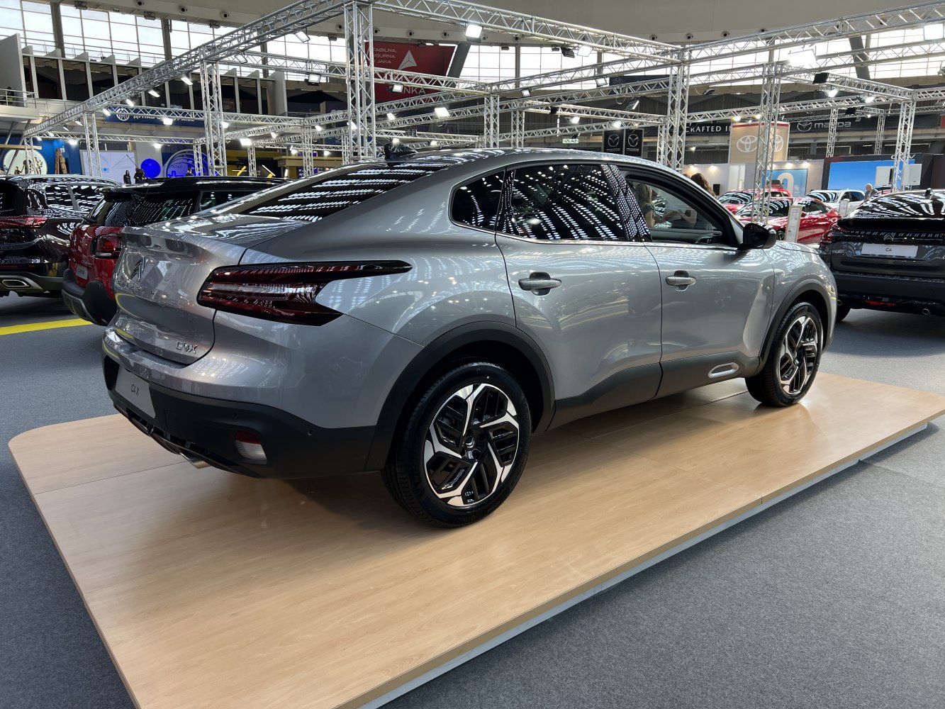 Rear view with sleek coupé-like shape and LED taillights