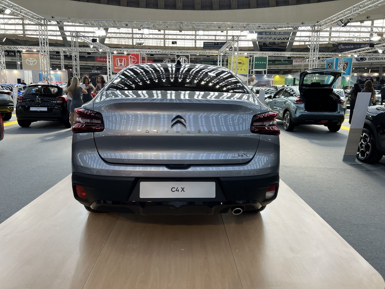 Sleek hatchback rear with LED tail lights and single exhaust pipe.