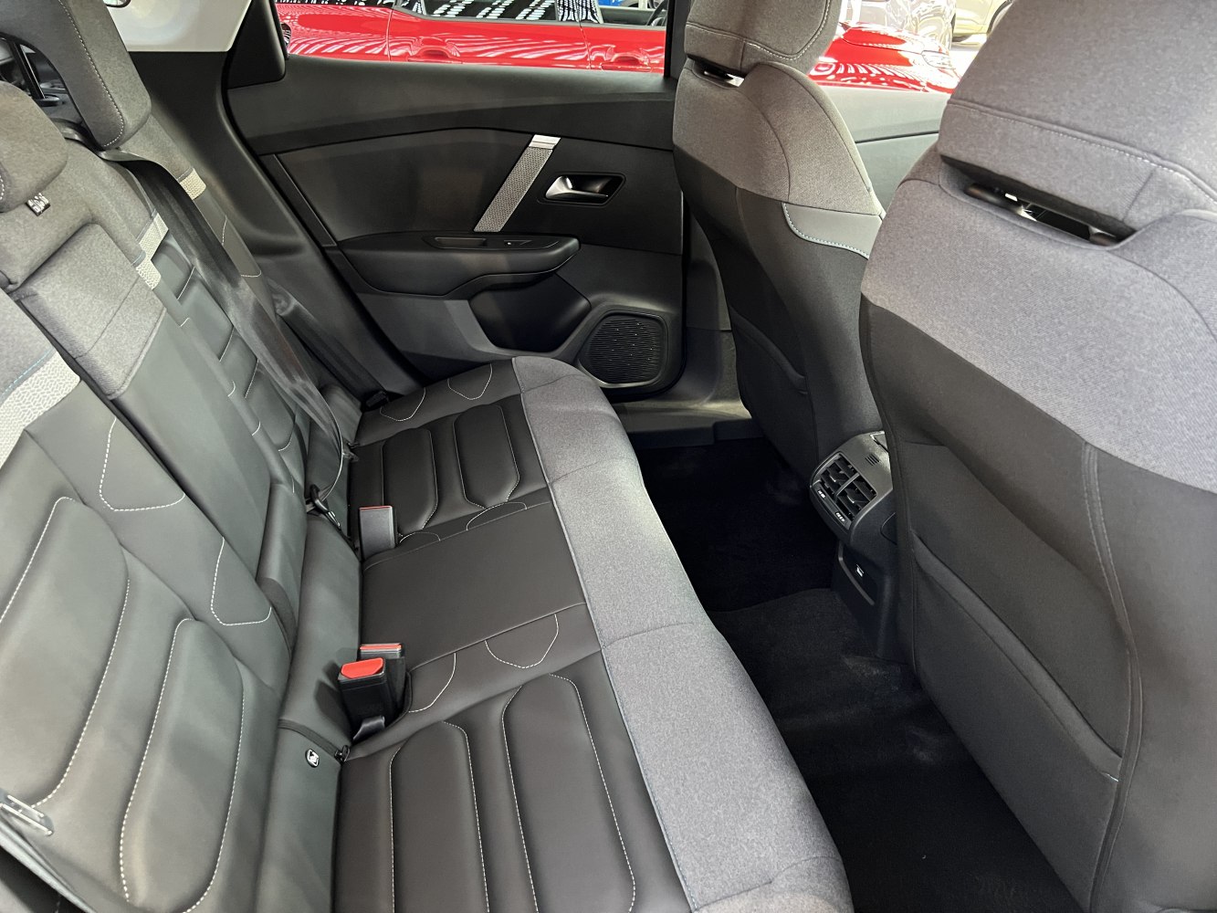 Rear seat interior with upholstery and rear air vents