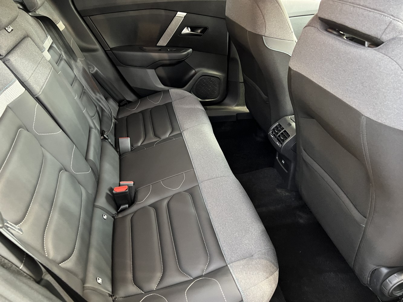 Rear seat interior with two-tone upholstery and rear air vents