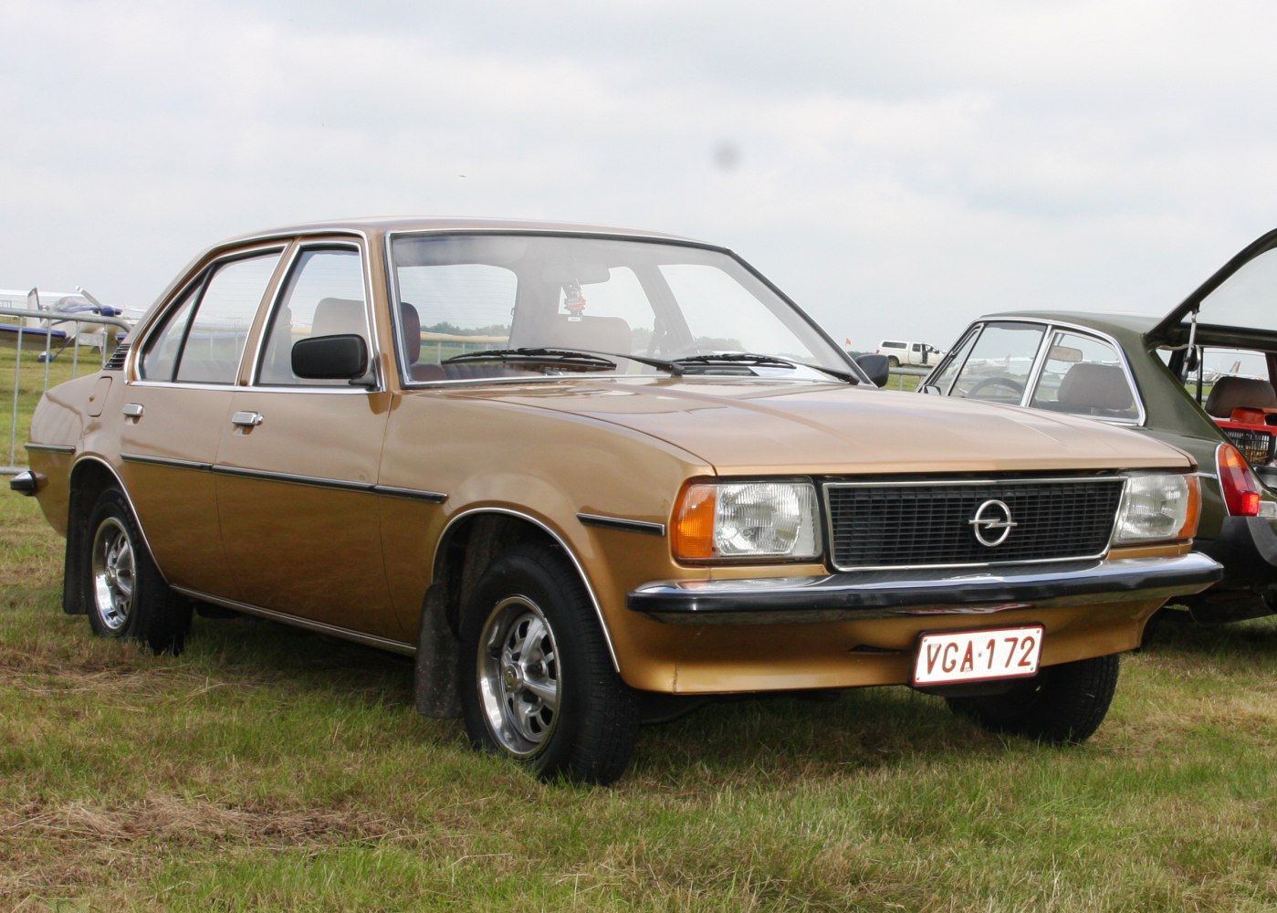 Vintage sedan with angular headlights and classic grille.