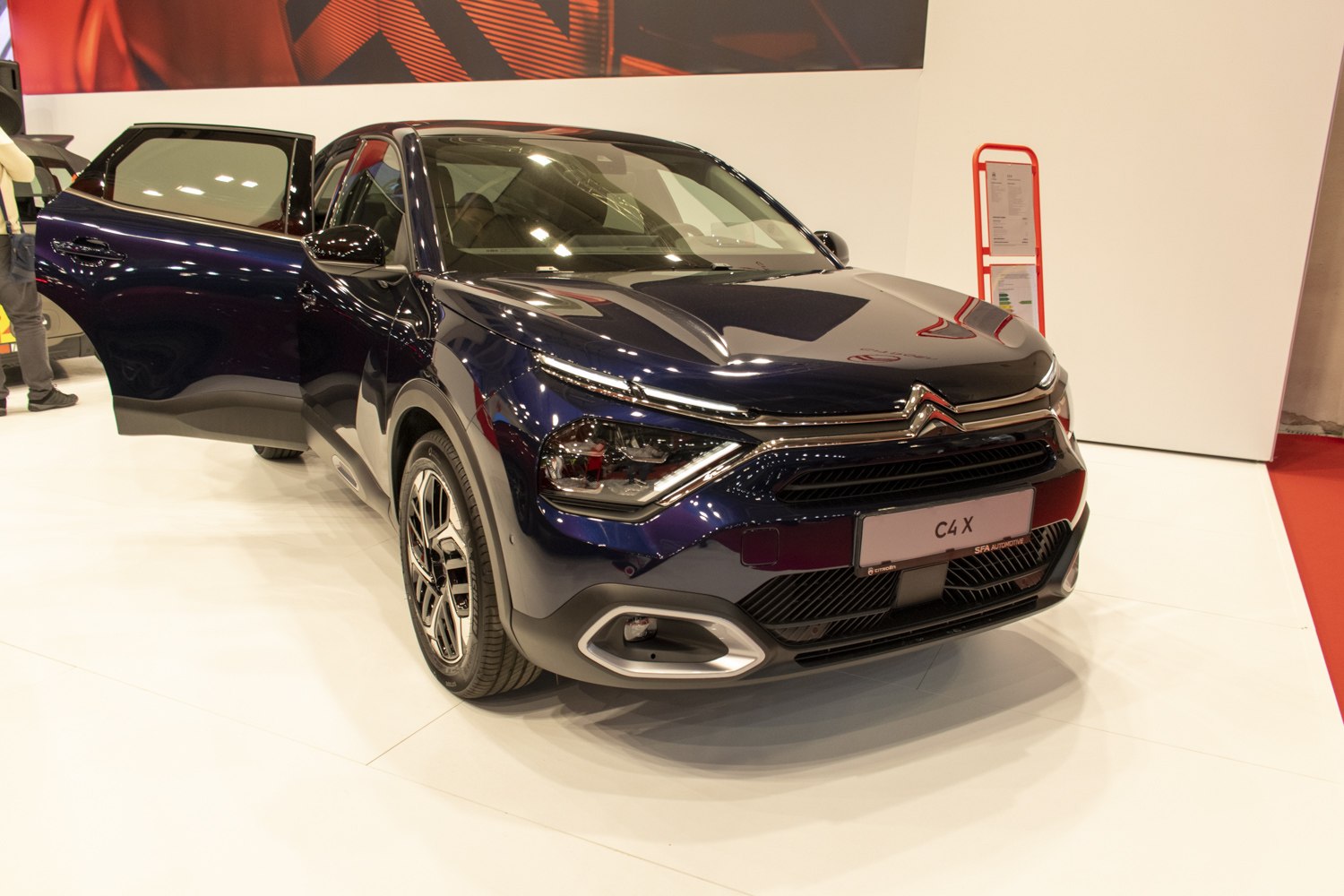 Front view of car with LED headlights and open door