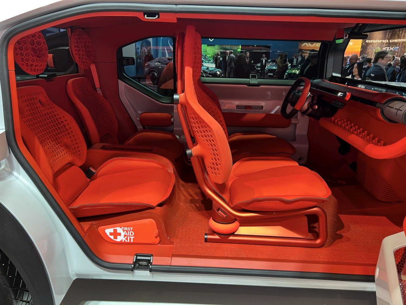 Vibrant ergonomic seats and integrated first aid kit inside a car interior
