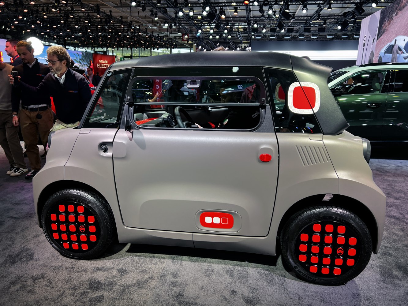 Compact electric vehicle with geometric patterns and futuristic boxy silhouette